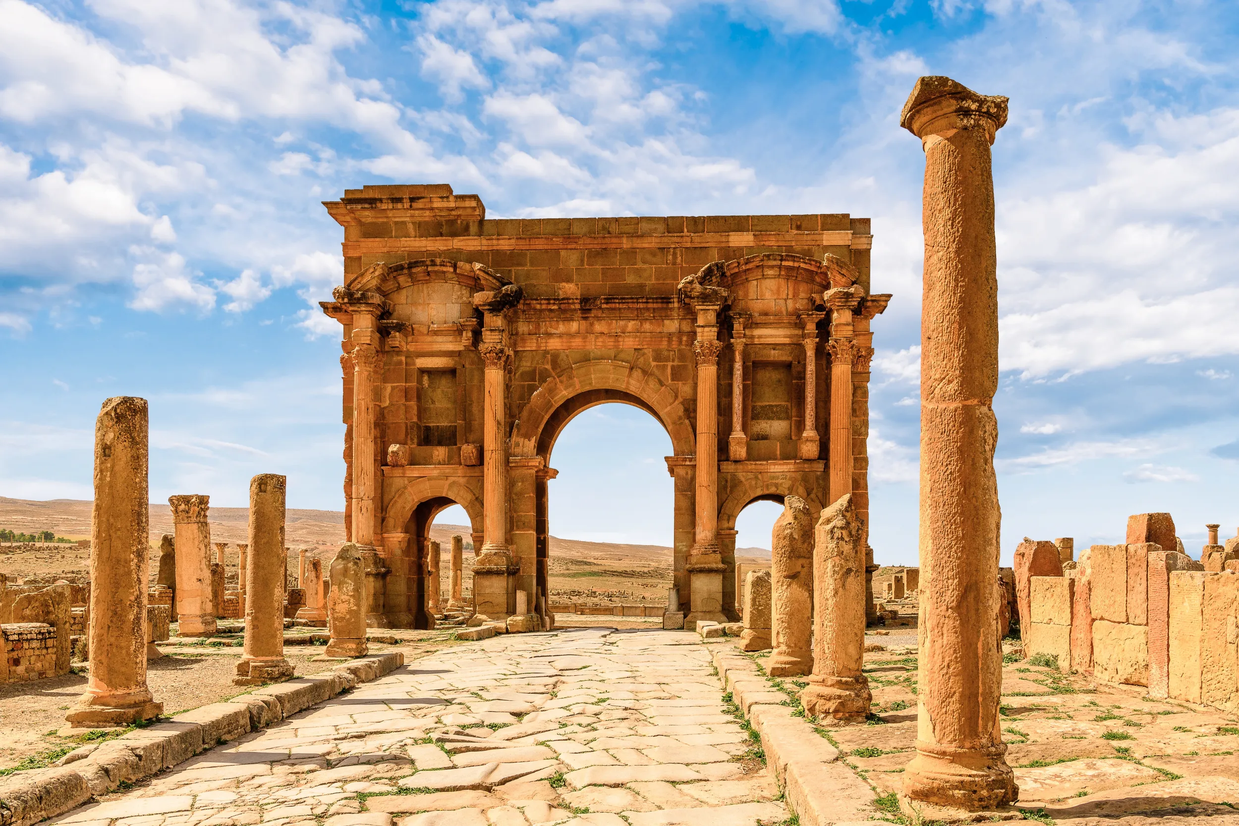 The Triumphal Arch of Trajan in Timgad.jpg